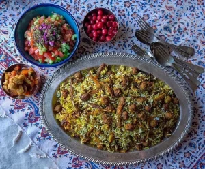 Kalam Polo Shirazi with a Side of Pickled Vegetables and Shirazi Salad