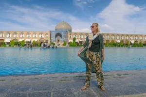Woman Standing in the Naghshe Jahan Square with the Sheikh Lotfollah Mosque in the Background